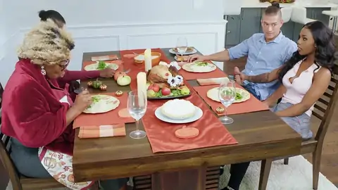 Tattooed ebony hoe is riding a BWC by the table