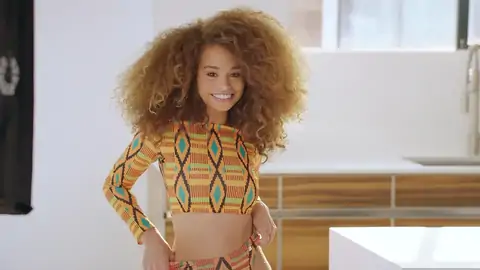 Teenage dark-hued with wavy hair is railing a fat fuckpole on the couch